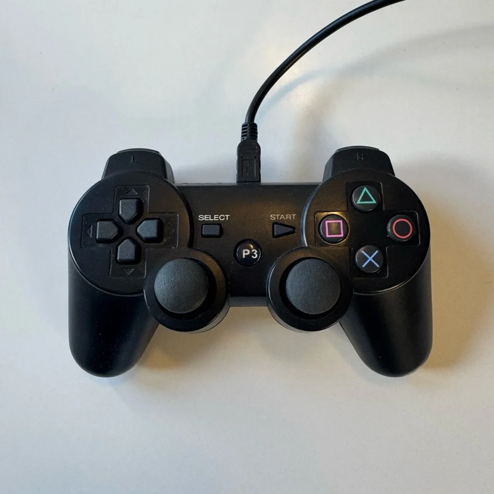 Sony PlayStation 3 Console with Black and White Controllers